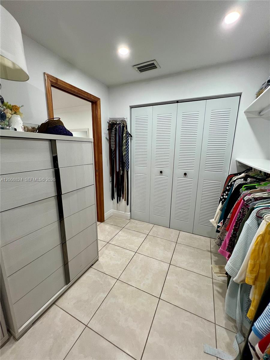 3610 Southwest 113th Place Miami, FL 33165 - Photo 14 of 49 a view of walk in closet