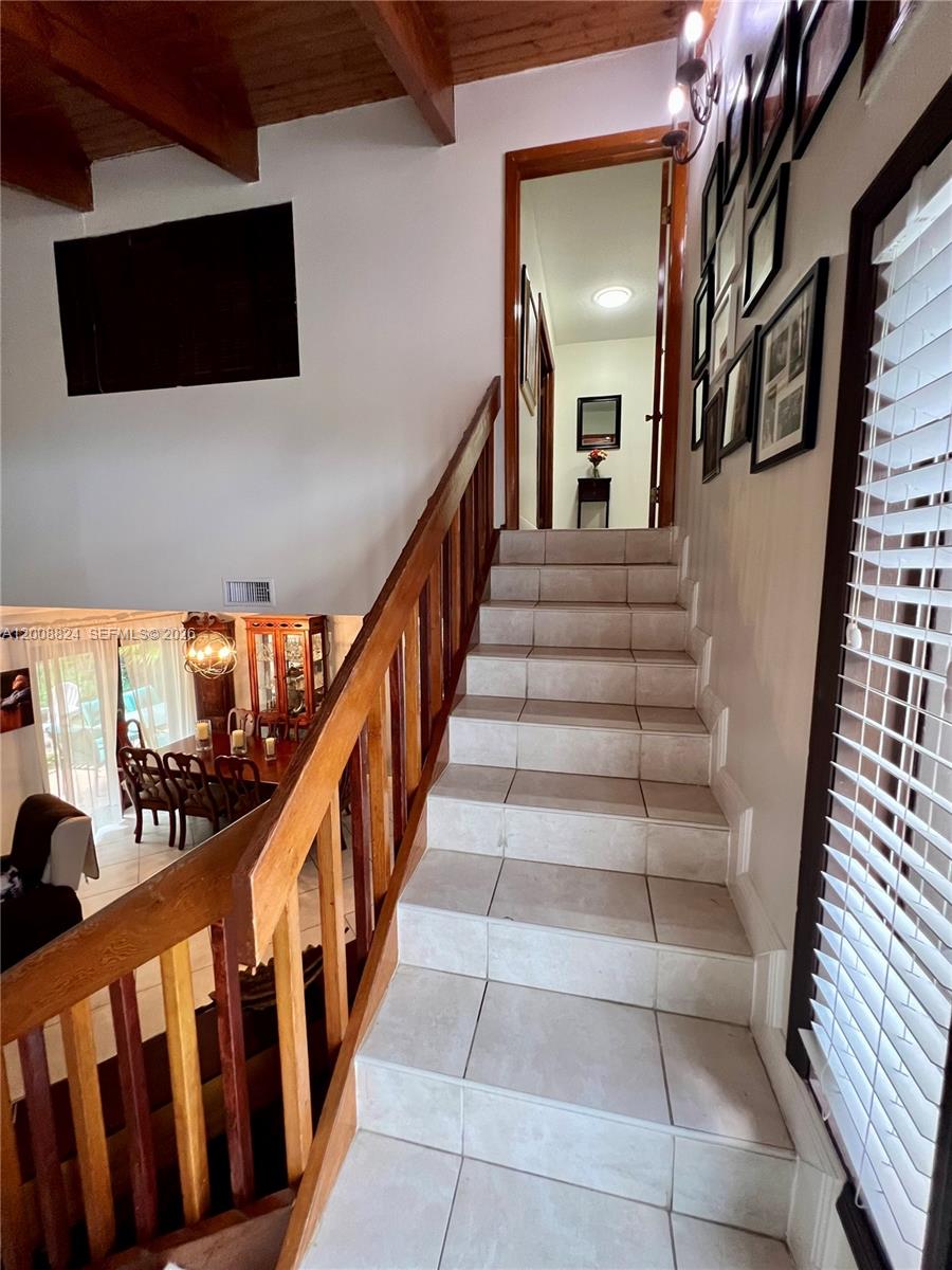 3610 Southwest 113th Place Miami, FL 33165 - Photo 23 of 49 a view of entryway and hall with wooden floor