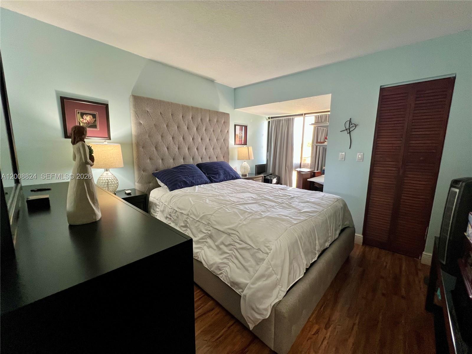 3610 Southwest 113th Place Miami, FL 33165 - Photo 26 of 49 a bedroom with a bed and wooden floor
