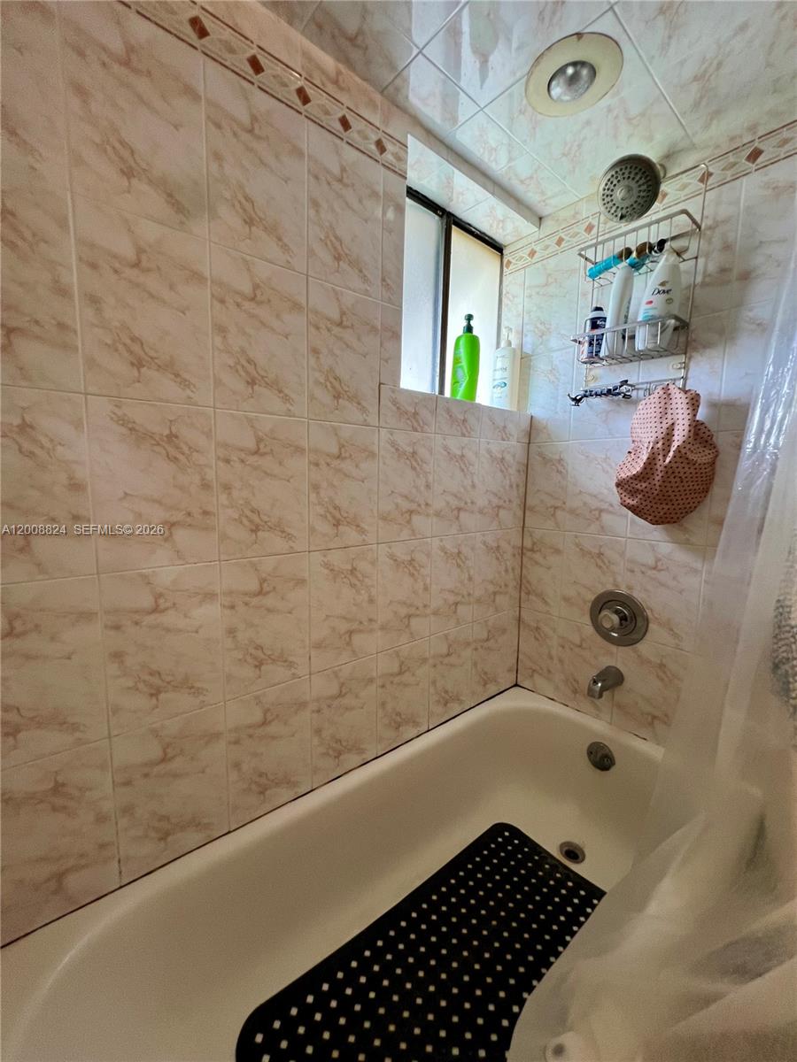 3610 Southwest 113th Place Miami, FL 33165 - Photo 30 of 49 a bathroom with a bathtub