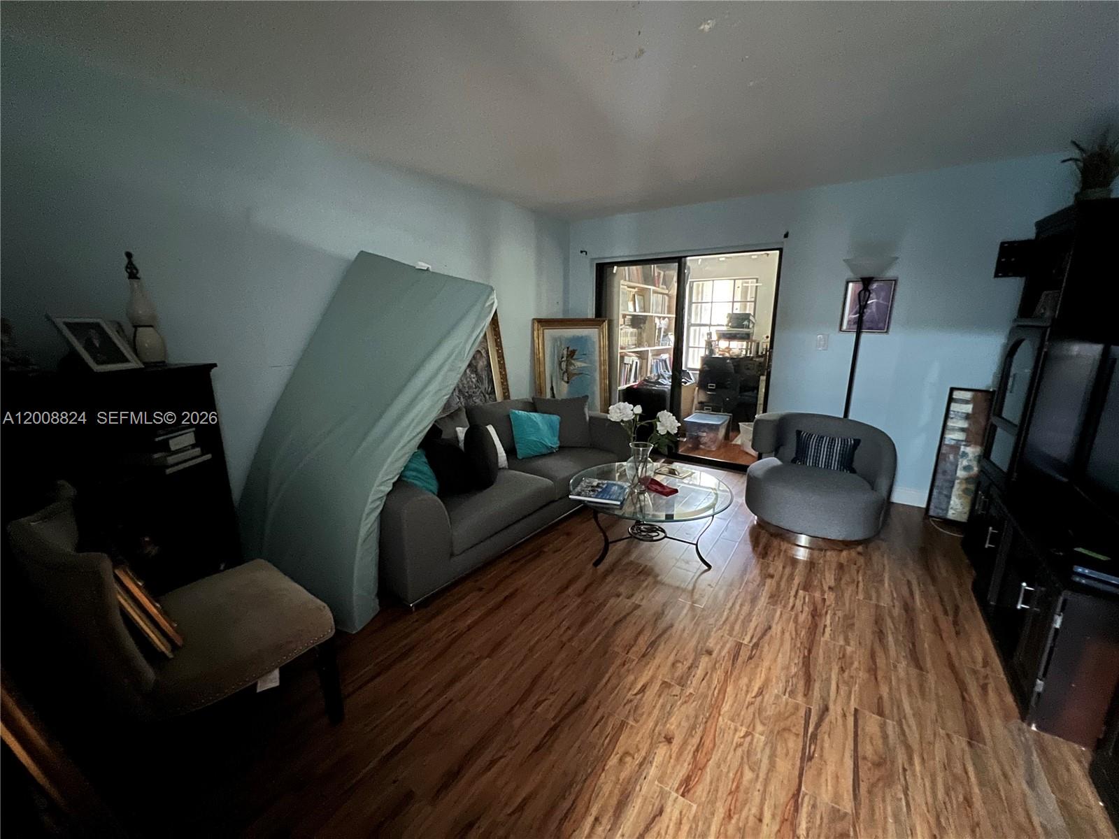 3610 Southwest 113th Place Miami, FL 33165 - Photo 36 of 49 a living room with furniture and a wooden floor