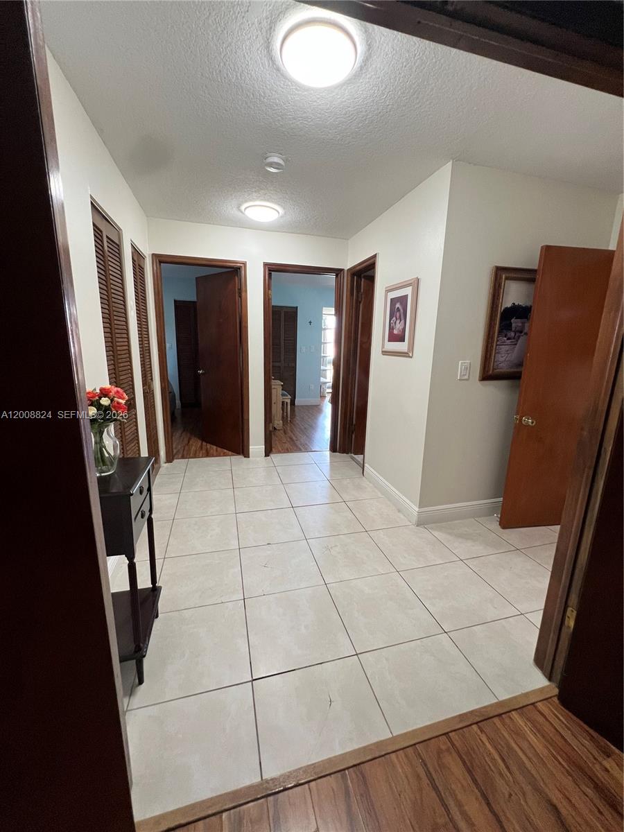 3610 Southwest 113th Place Miami, FL 33165 - Photo 37 of 49 a view of a refrigerator in kitchen and wooden floor