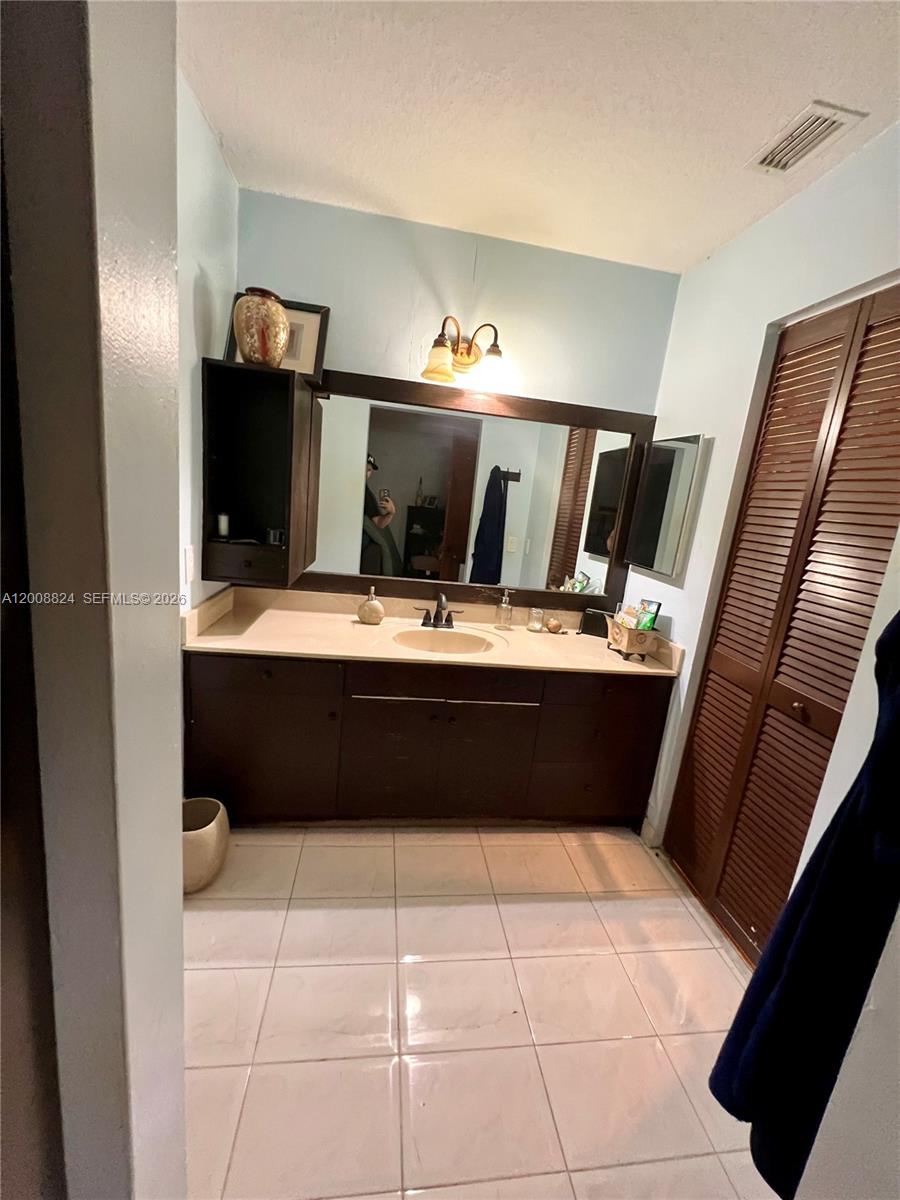 3610 Southwest 113th Place Miami, FL 33165 - Photo 38 of 49 a room with a mirror