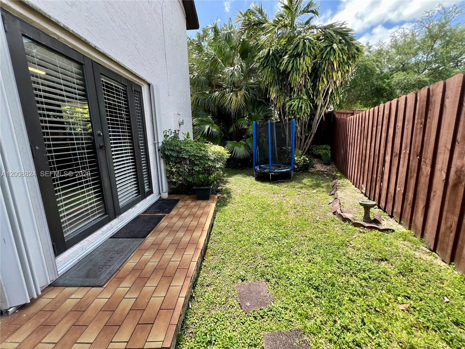 3610 Southwest 113th Place Miami, FL 33165 - Photo 44 of 49 a view of backyard with garden and deck