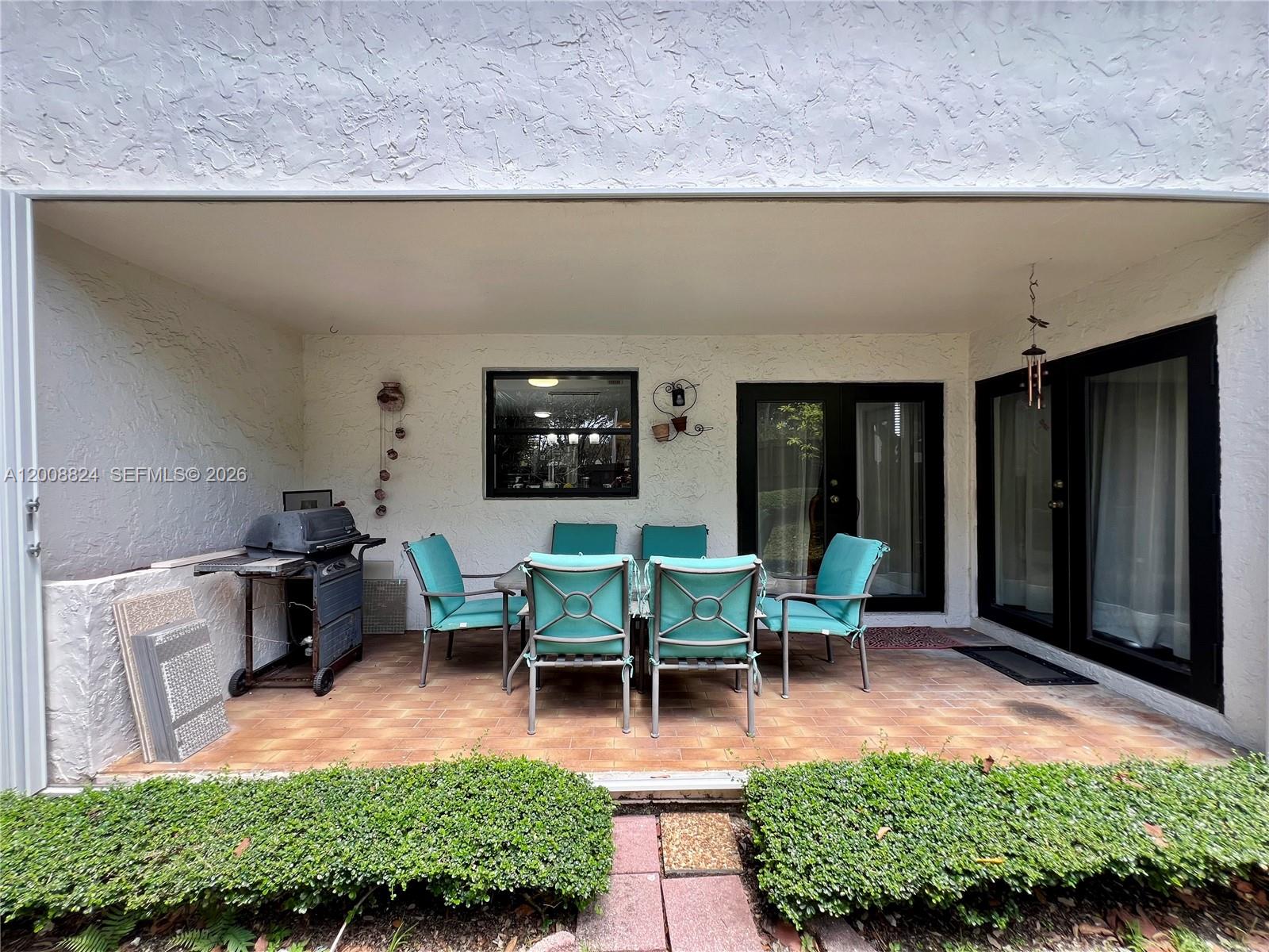 3610 Southwest 113th Place Miami, FL 33165 - Photo 49 of 49 a view of a house with backyard sitting area and garden
