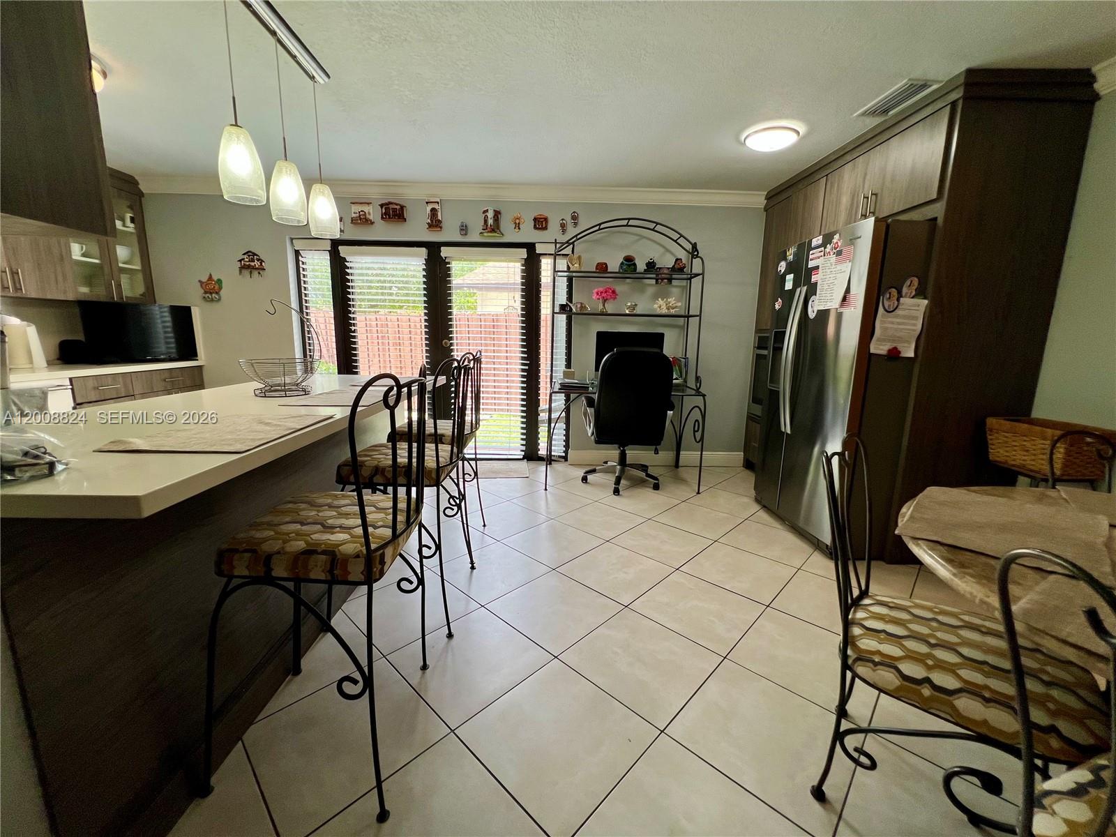 3610 Southwest 113th Place Miami, FL 33165 - Photo 6 of 49 a view of a dining room with furniture