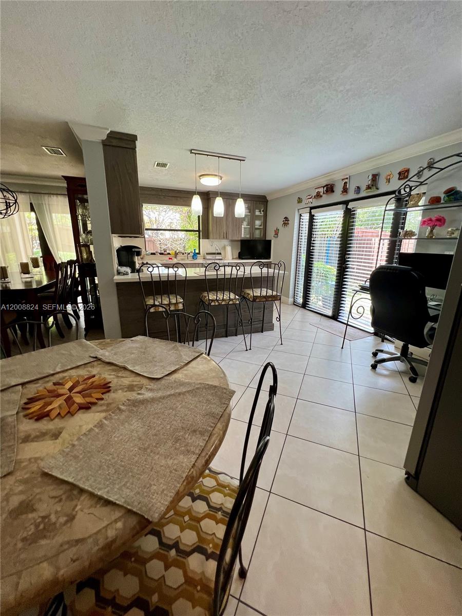 3610 Southwest 113th Place Miami, FL 33165 - Photo 9 of 49 a view of a living room and dining room