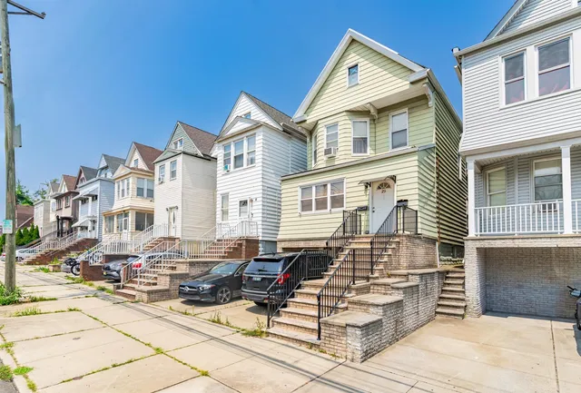 a front view of a house with glass windows