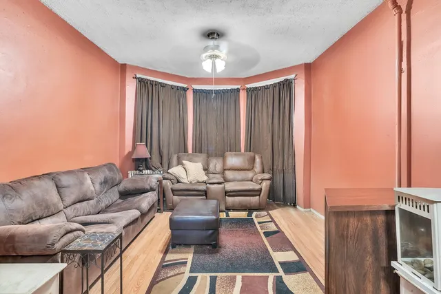 a kitchen with a stove a refrigerator and a stove top oven