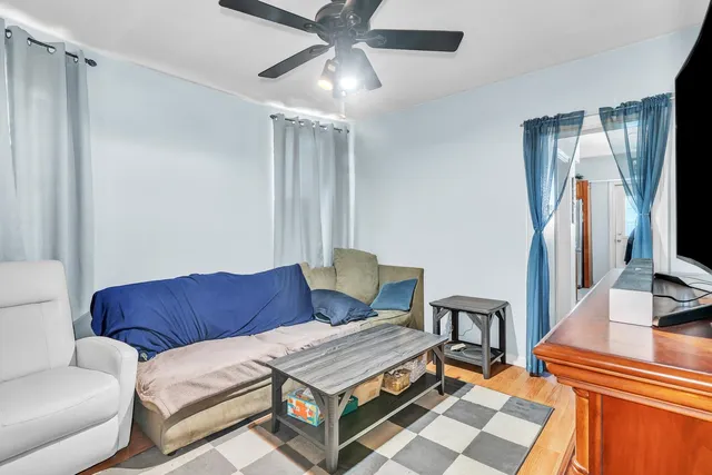 a living room with furniture and a rug