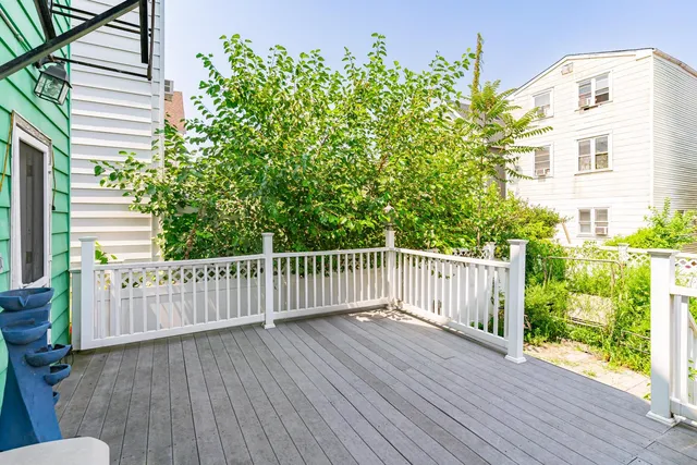 a view of a wooden fence and trees