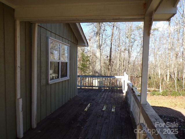 75 Bradley Turn Mill Spring, NC 28756 - Photo 13 of 20 a view of balcony with wooden floor