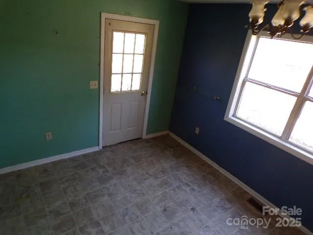 a kitchen with a refrigerator and a sink