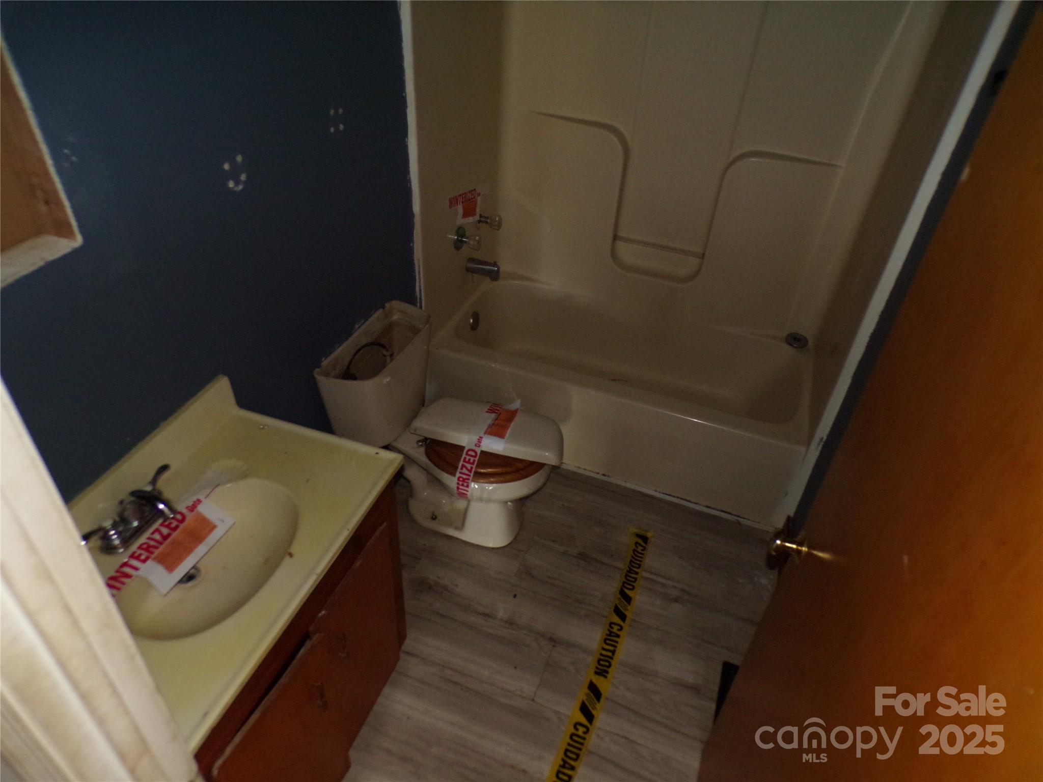 75 Bradley Turn Mill Spring, NC 28756 - Photo 17 of 20 a bathroom with a sink and toilet