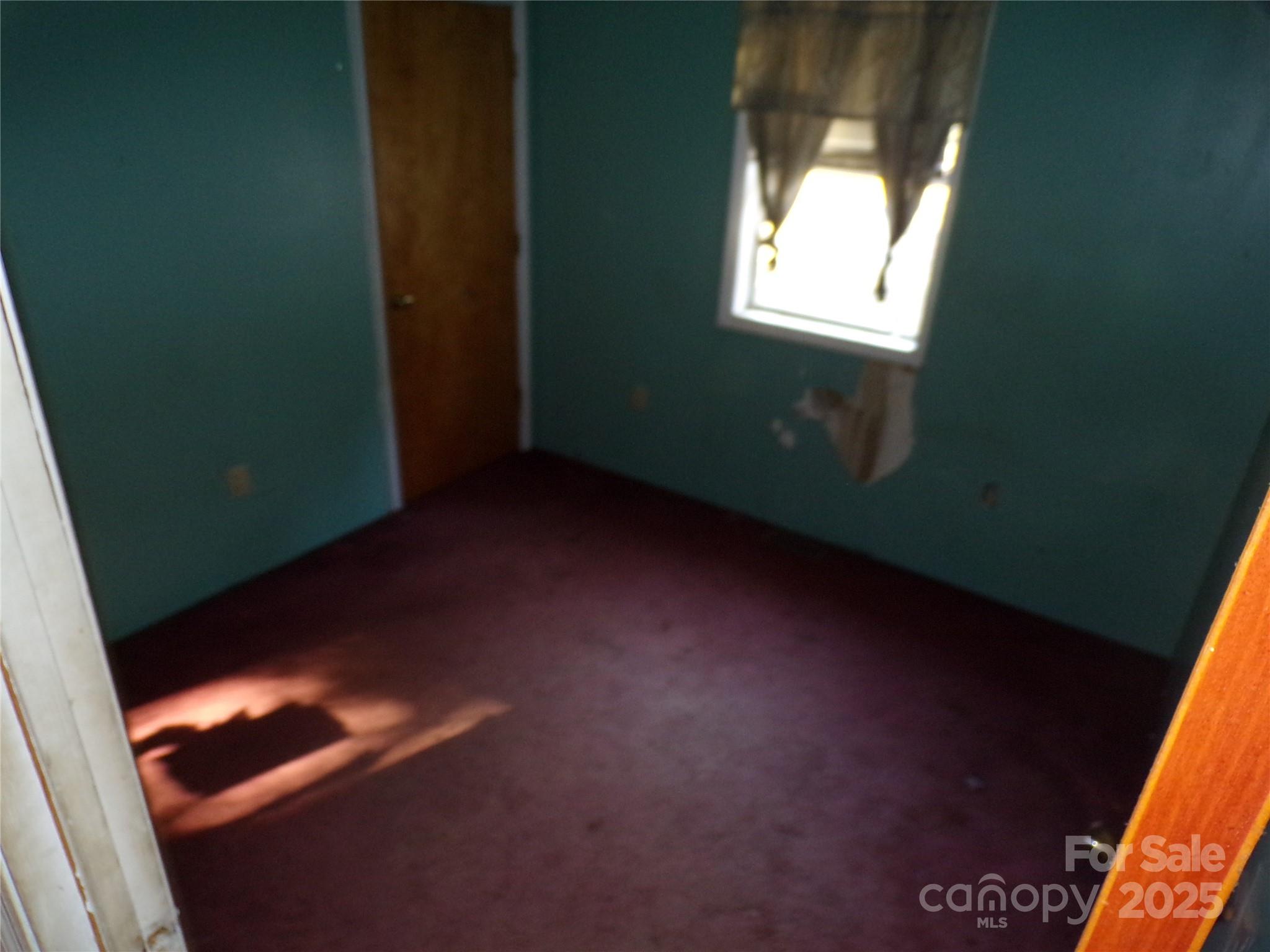 75 Bradley Turn Mill Spring, NC 28756 - Photo 18 of 20 an empty room with a window