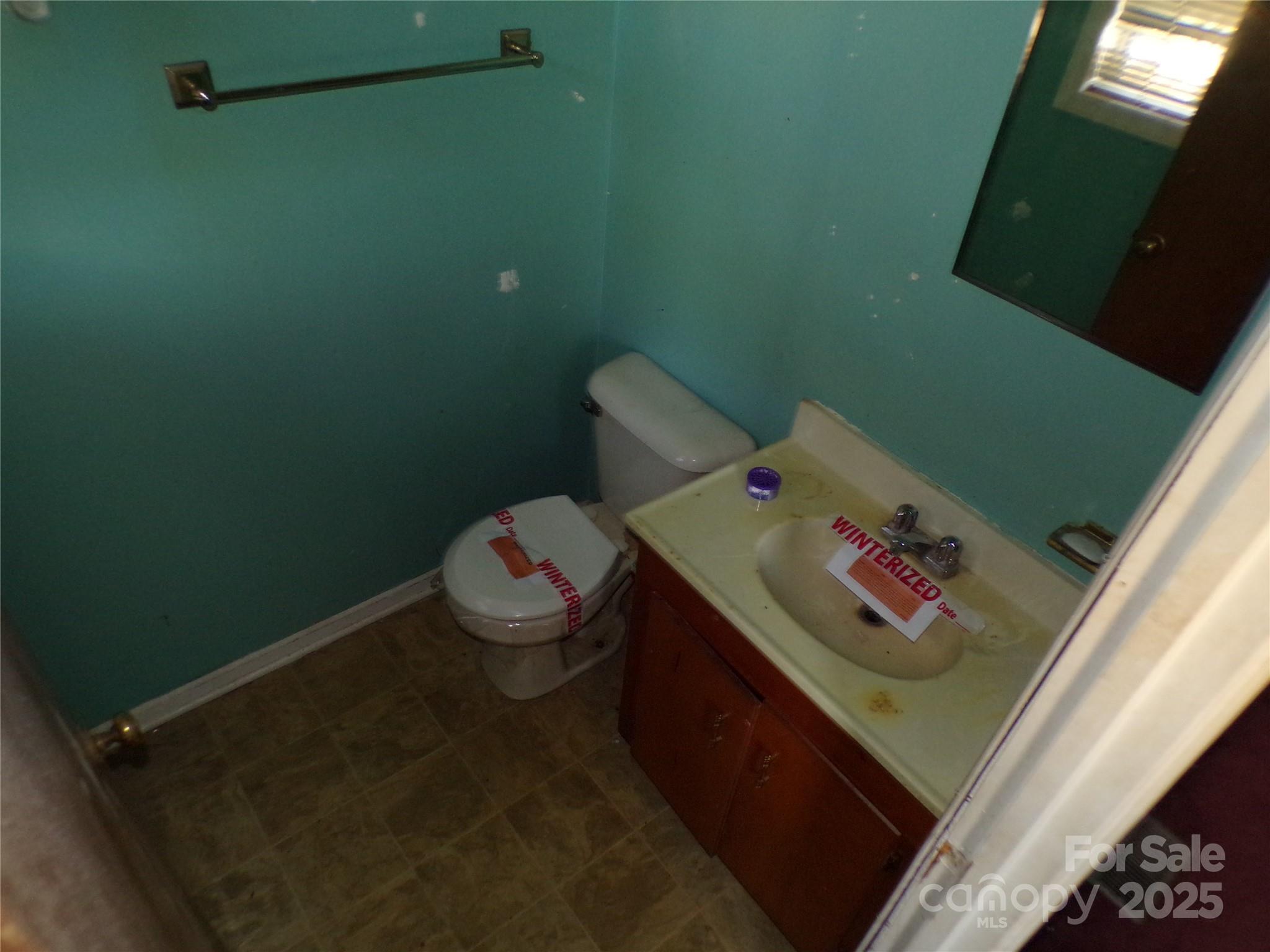 75 Bradley Turn Mill Spring, NC 28756 - Photo 20 of 20 a bathroom with a toilet and a sink