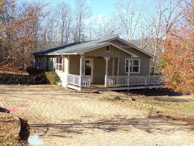 a view of a house with snow on the background
