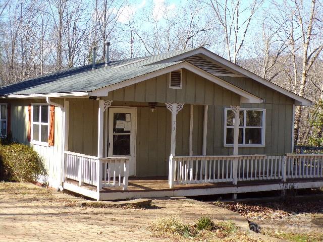 75 Bradley Turn Mill Spring, NC 28756 - Photo 3 of 20 a front view of a house with a yard