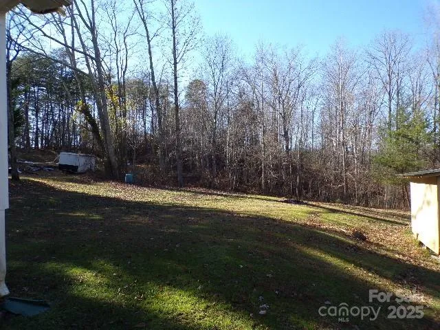 a view of a backyard of the house