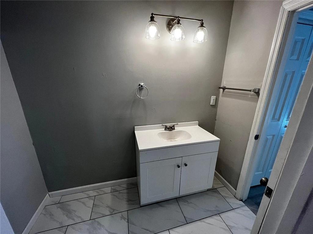 3932 Darryl Lane Gainesville, GA 30506 - Photo 11 of 34 a bathroom with a sink and mirror