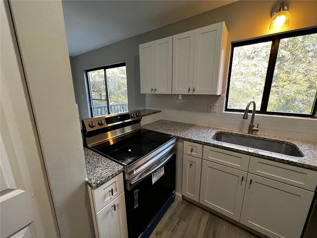 3932 Darryl Lane Gainesville, GA 30506 - Photo 17 of 34 a kitchen that has a sink and a stove
