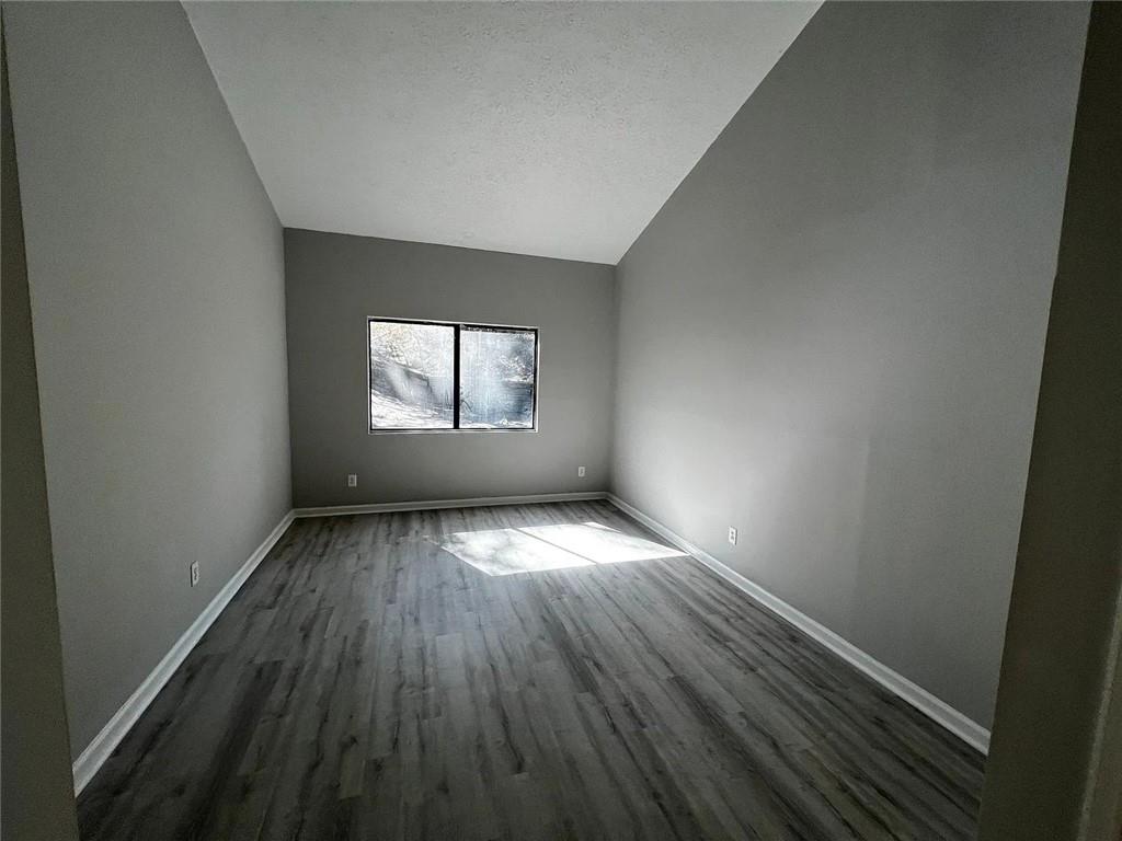 3932 Darryl Lane Gainesville, GA 30506 - Photo 22 of 34 an empty room with wooden floor and windows