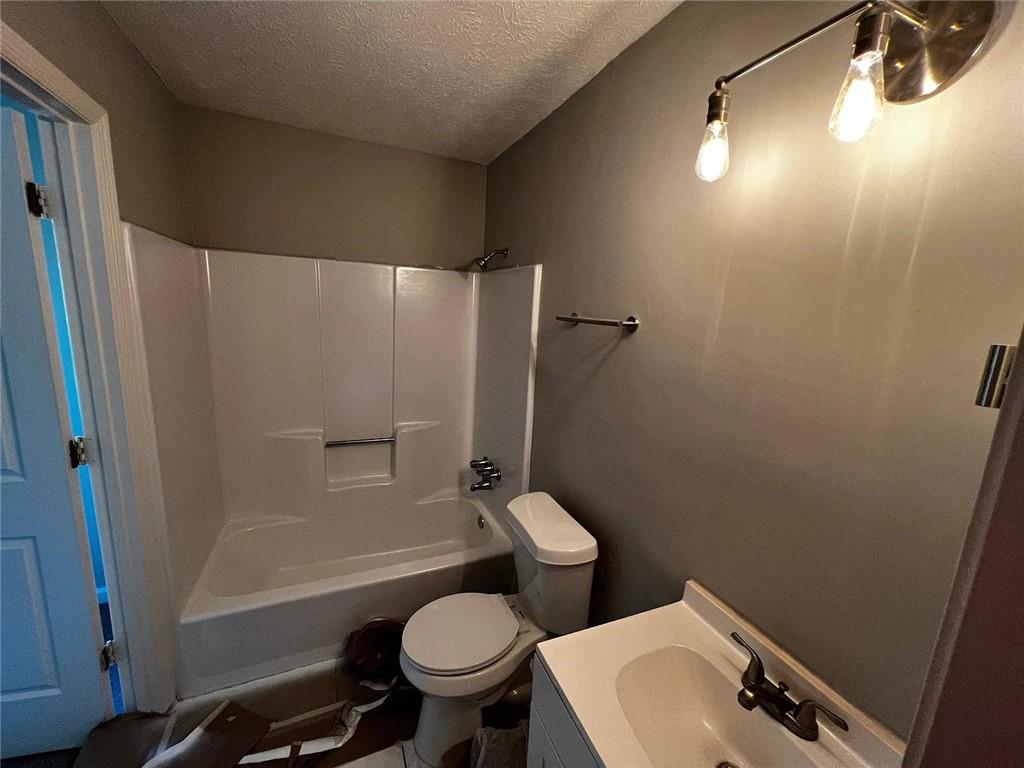 3932 Darryl Lane Gainesville, GA 30506 - Photo 24 of 34 a bathroom with a sink toilet and shower