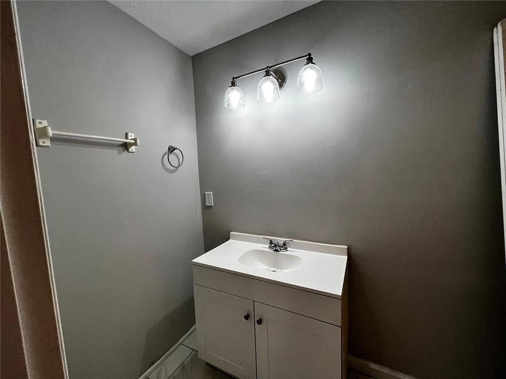 3932 Darryl Lane Gainesville, GA 30506 - Photo 26 of 34 a bathroom with a sink and mirror