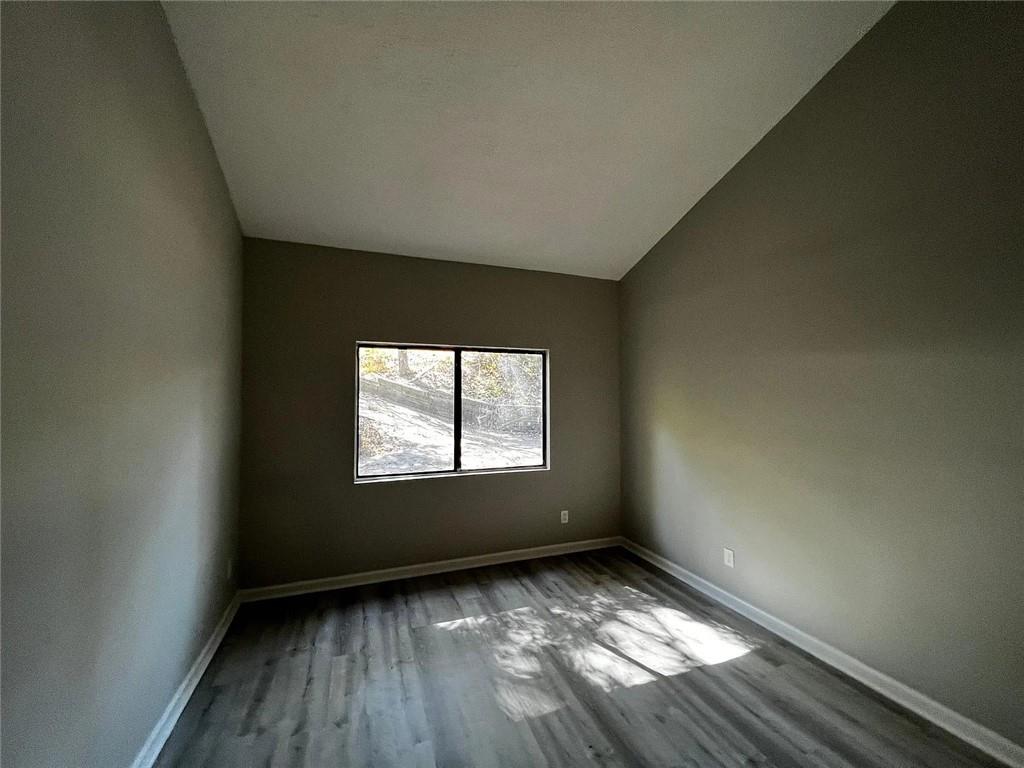 3932 Darryl Lane Gainesville, GA 30506 - Photo 29 of 34 an empty room with wooden floor and windows