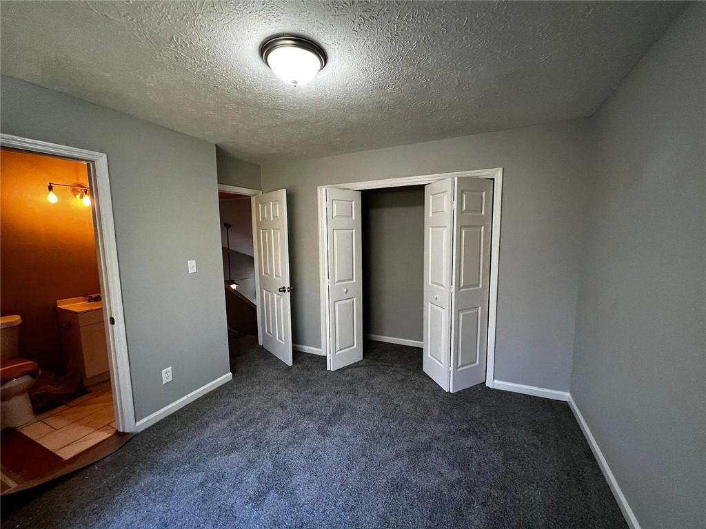 3932 Darryl Lane Gainesville, GA 30506 - Photo 31 of 34 an empty room with closet and mirror