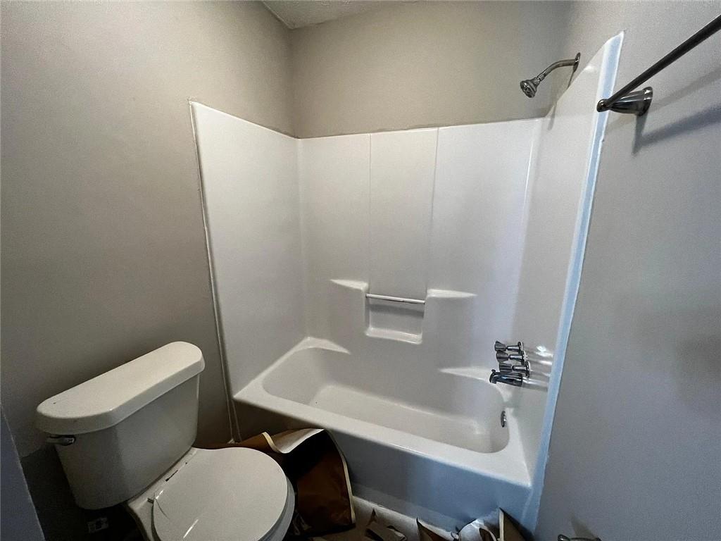 3932 Darryl Lane Gainesville, GA 30506 - Photo 34 of 34 a white toilet sitting next to a bathroom sink