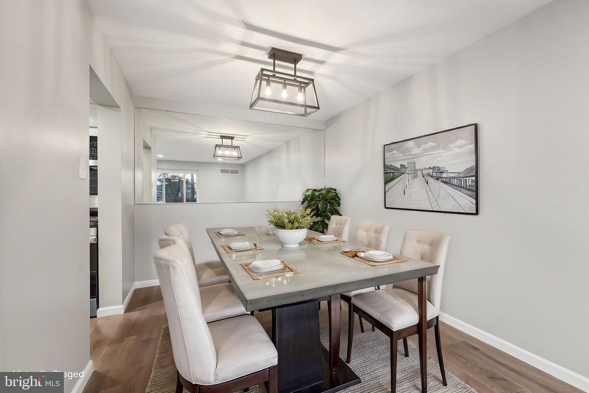 203 Drummers Lane, Unit 203 Wayne, PA 19087 - Photo 13 of 40 a view of a dining room with furniture