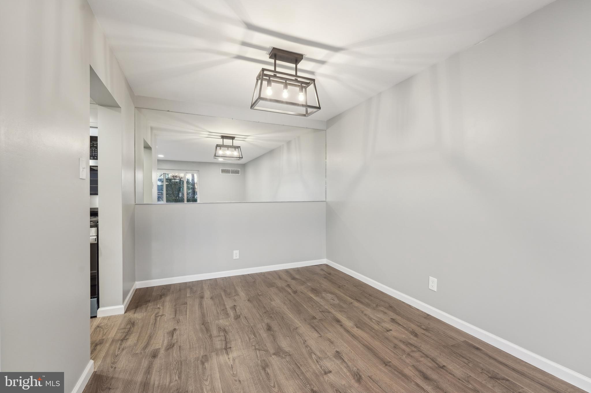 203 Drummers Lane, Unit 203 Wayne, PA 19087 - Photo 14 of 40 a view of a hallway with wooden floor