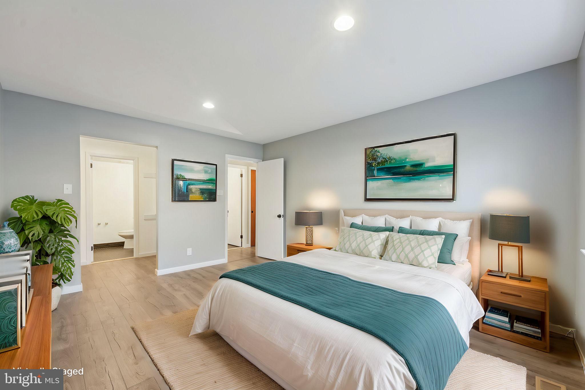 203 Drummers Lane, Unit 203 Wayne, PA 19087 - Photo 17 of 40 a bedroom with a bed and a couch