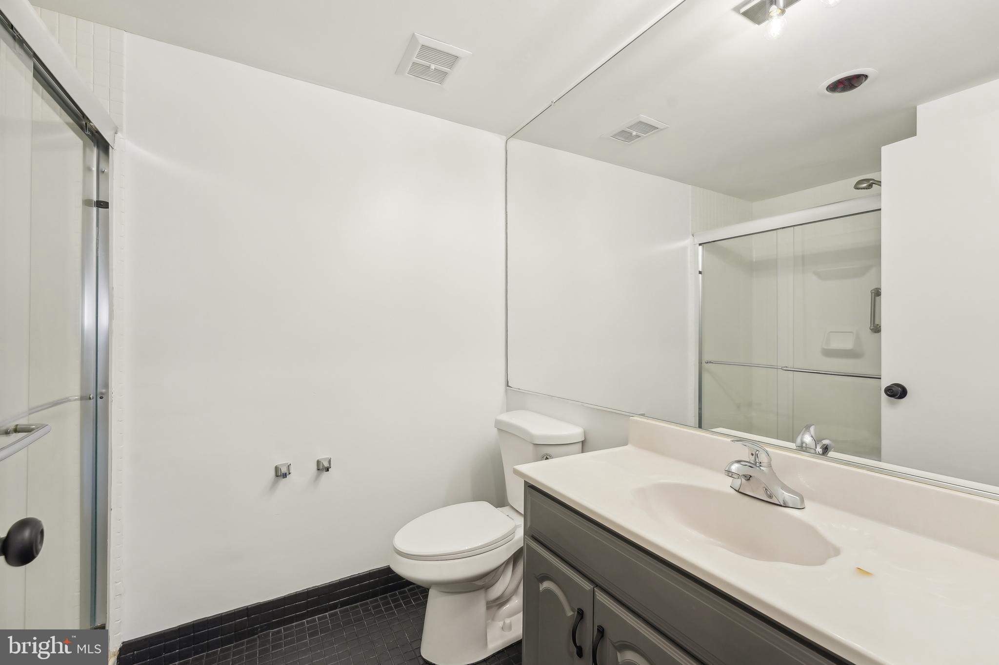203 Drummers Lane, Unit 203 Wayne, PA 19087 - Photo 20 of 40 a bathroom with a sink and a toilet
