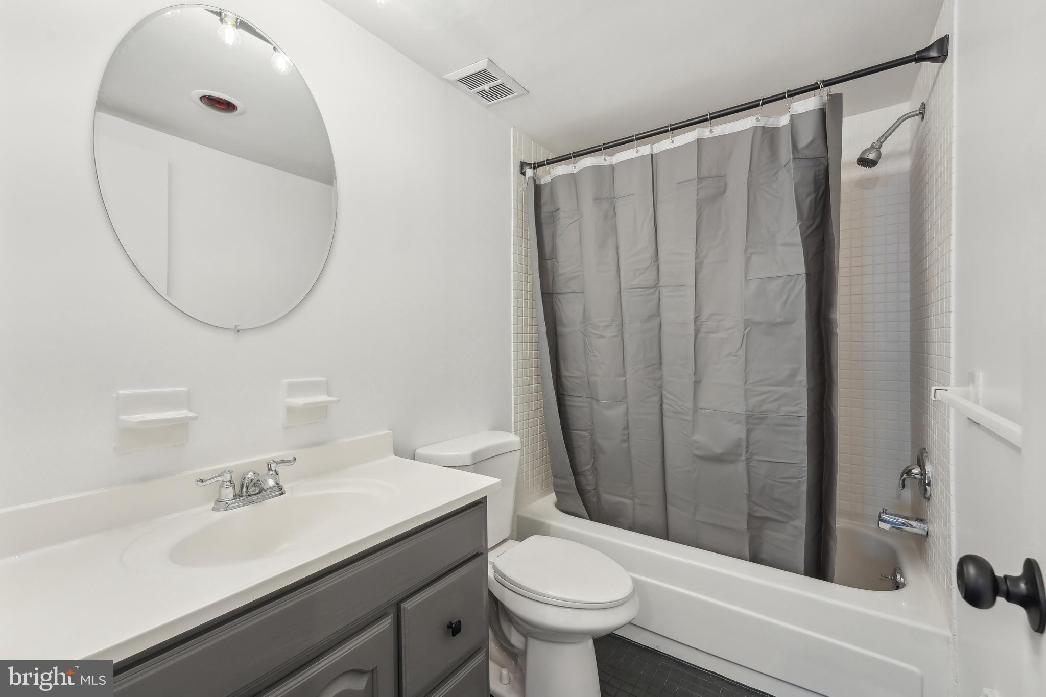 203 Drummers Lane, Unit 203 Wayne, PA 19087 - Photo 23 of 40 a bathroom with a sink toilet and shower