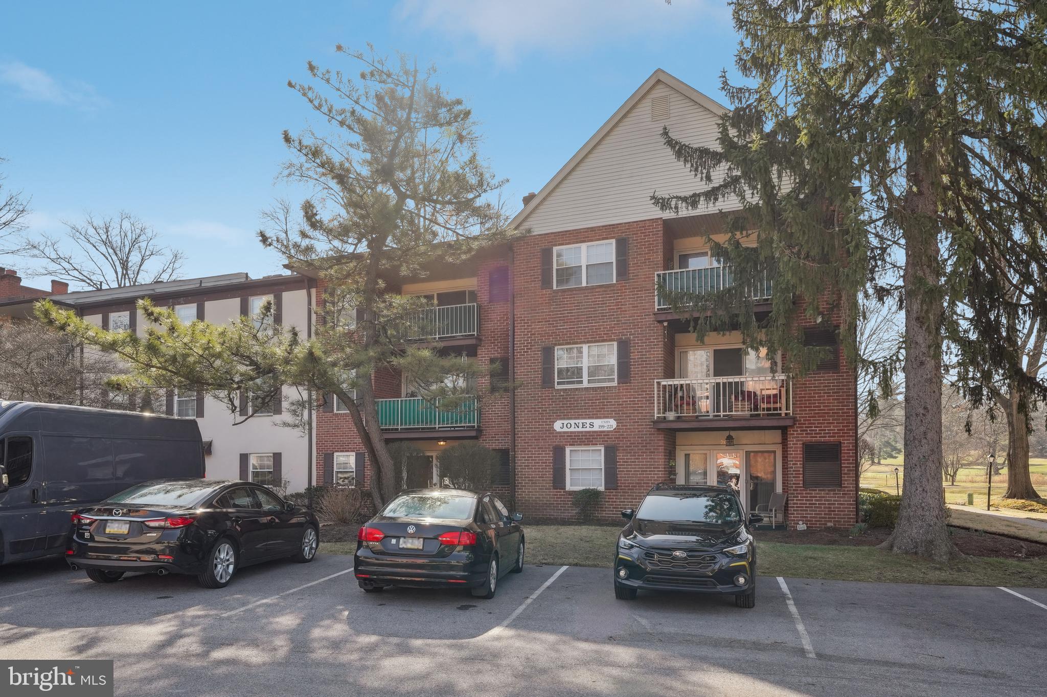 203 Drummers Lane, Unit 203 Wayne, PA 19087 - Photo 24 of 40 a car parked in front of a house
