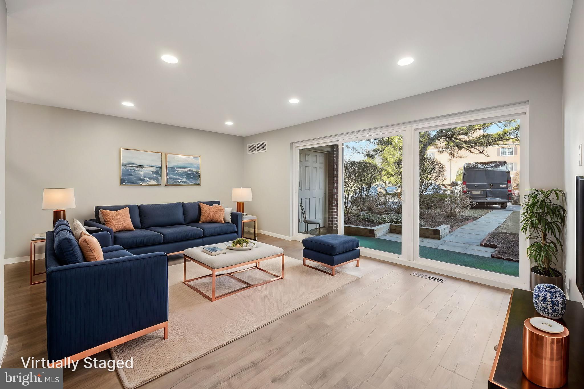 203 Drummers Lane, Unit 203 Wayne, PA 19087 - Photo 4 of 40 a living room with furniture and a large window
