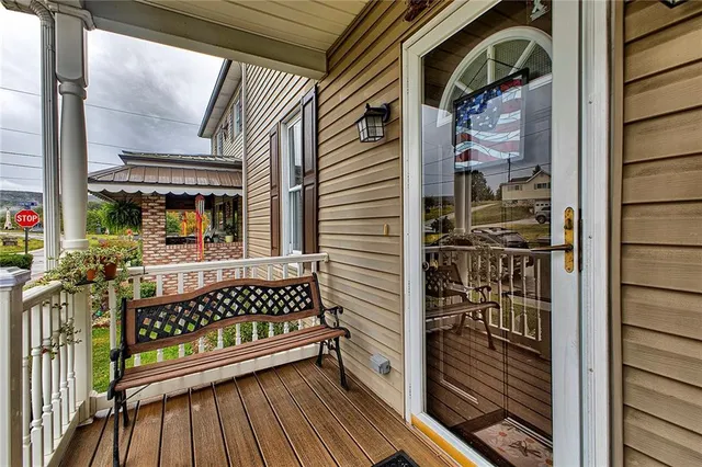 a view of front door with wooden floor