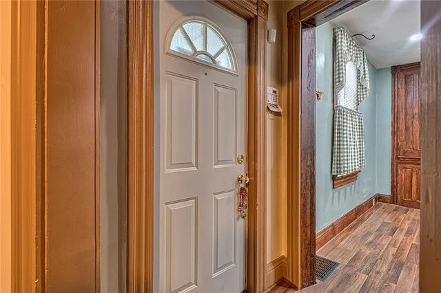 a living room with furniture a fireplace and a table