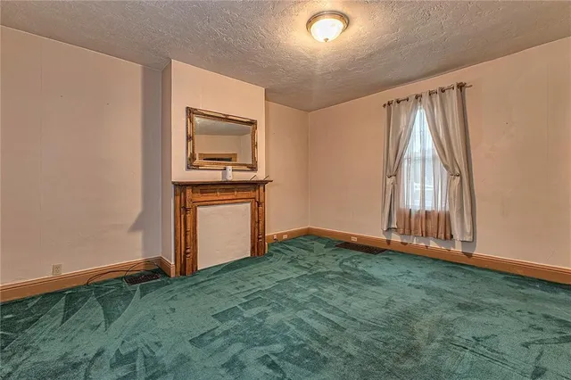 a kitchen with granite countertop wooden floors stainless steel appliances and sink