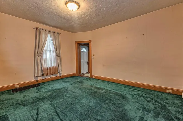 a view of a livingroom with wooden floor