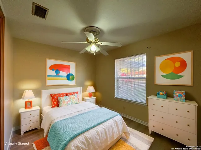 a bedroom with a bed and a dresser