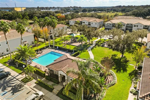 an aerial view of a house with a swimming pool