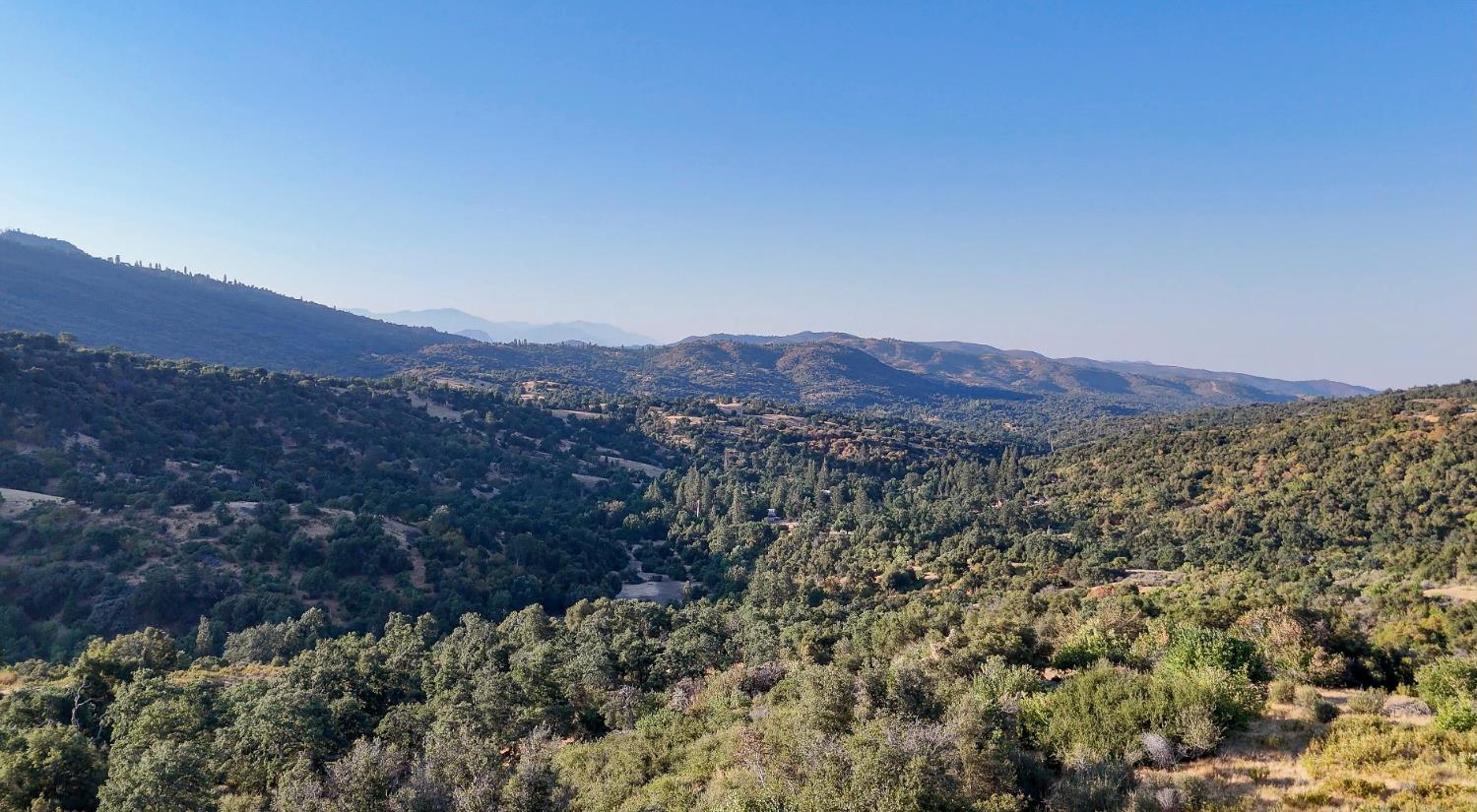 0 Whitaker Forest Road Miramonte, CA 93603 - Photo 21 of 78 a view of a lush green field with mountains in the background
