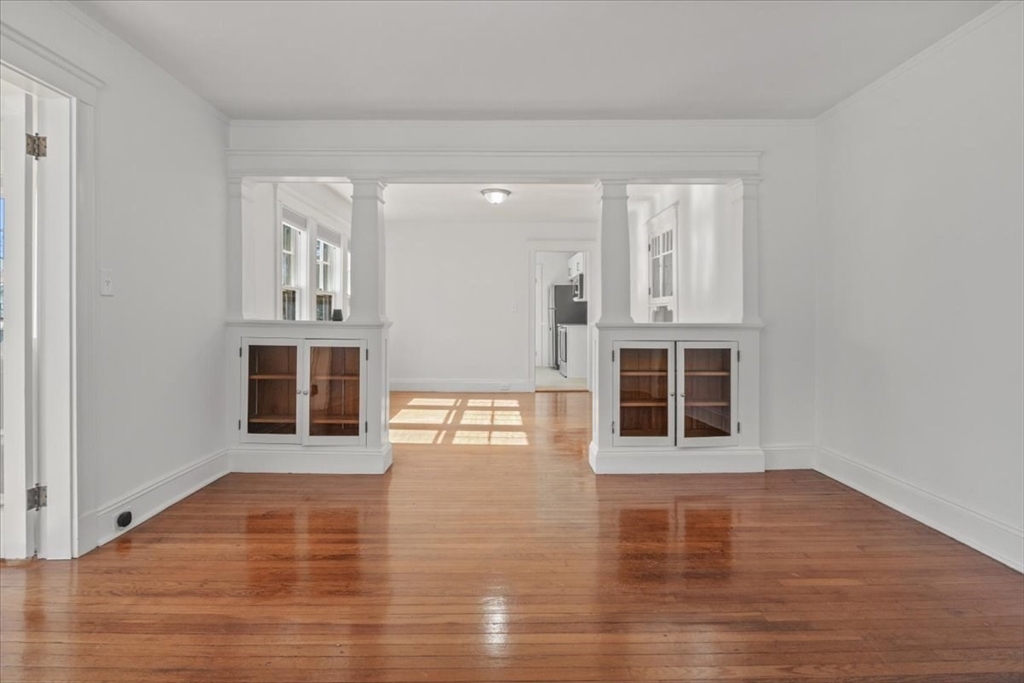 558 Lagrange Street, Unit 1 Boston, MA 02132 - Photo 17 of 40 a view of a livingroom with wooden floor