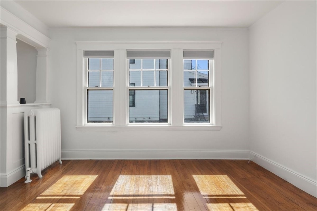 558 Lagrange Street, Unit 1 Boston, MA 02132 - Photo 23 of 40 a view of an empty room with a window
