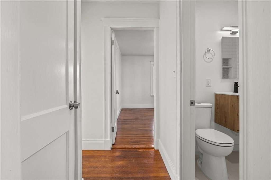 558 Lagrange Street, Unit 1 Boston, MA 02132 - Photo 24 of 40 a bathroom with a toilet and a shower