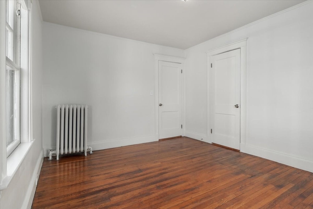 558 Lagrange Street, Unit 1 Boston, MA 02132 - Photo 31 of 40 wooden floor in an empty room