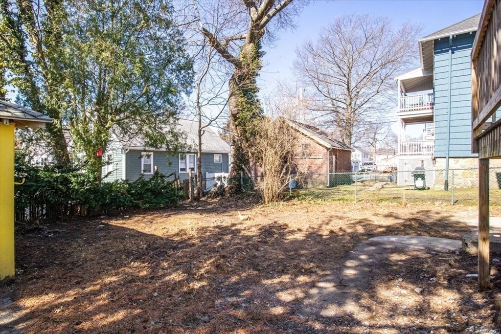 558 Lagrange Street, Unit 1 Boston, MA 02132 - Photo 33 of 40 a view of a yard with a house